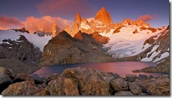 Argentina, Santa Cruz, Los Glaciares National Park, Alpenglow illuminates Mount Fitz Roy (11,073ft/3,375m), Aguja Poincenot, and Aguja Saint Exupery above Laguna de los Tres
